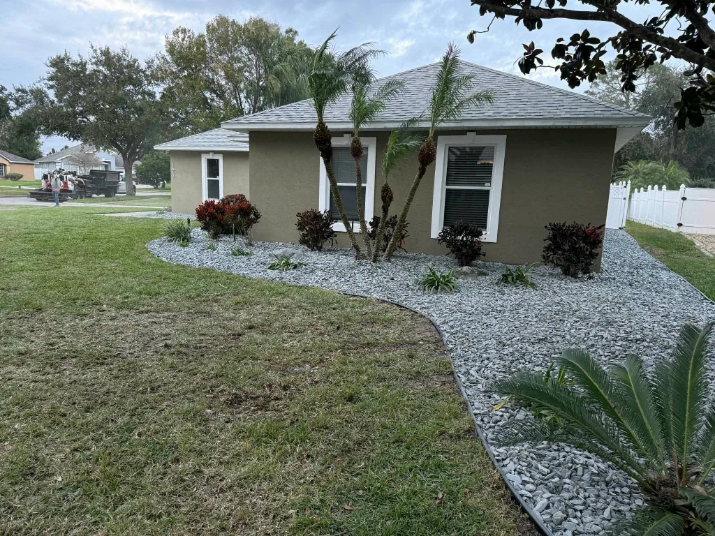 Decorative rock landscape wrapping around a home
